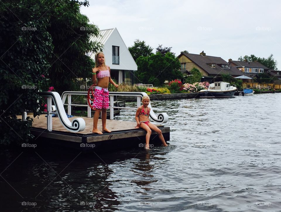 Two girls on a landing stage