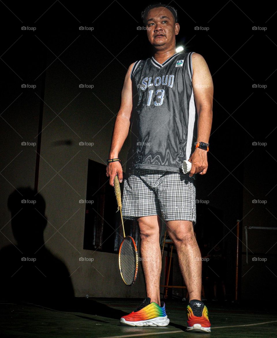 a badminton player posing before a match