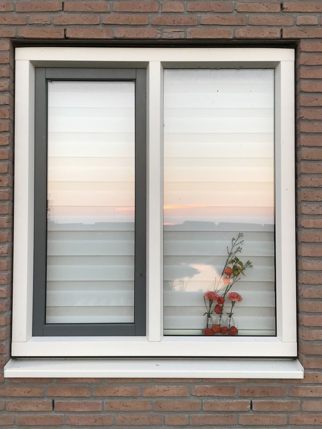 Sunset window.. elements working together and creating a painting. Thanksgiving decorations turned into a wonderful surprising image.