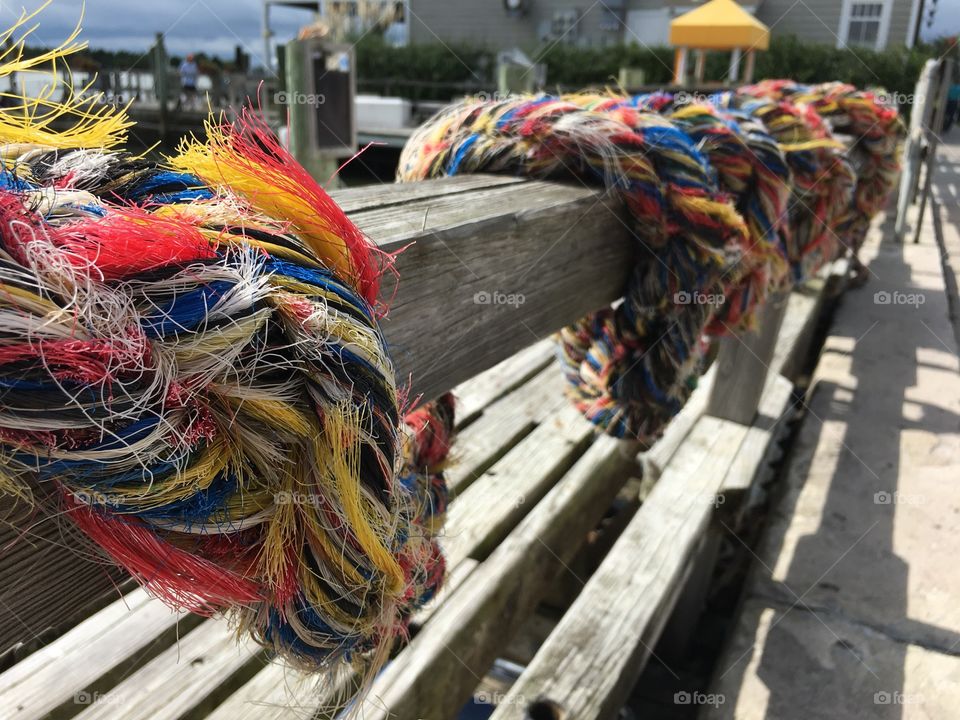 The beauty of this colorful but fabulously frayed rope at a marina is what makes it stand out in its imperfections.