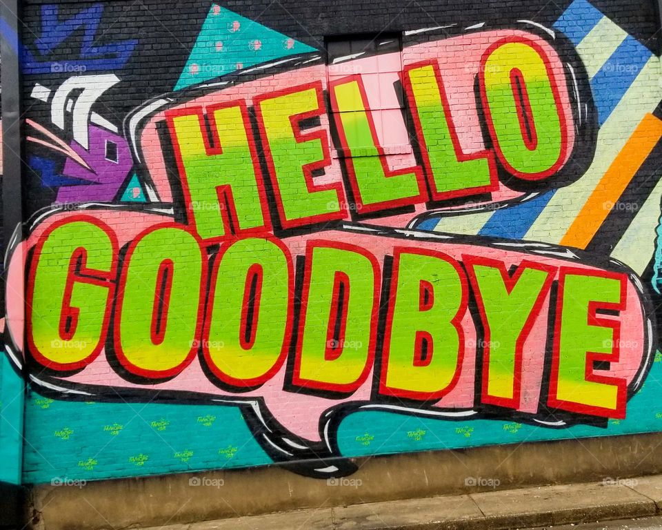 Colorful Street Art on a Brick Wall...Hello.. Goodbye Graffiti