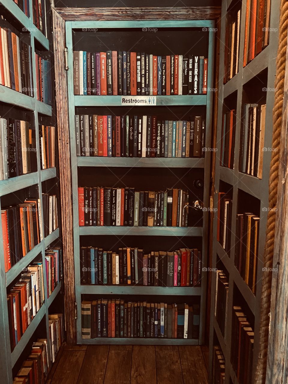 Restroom door that’s also a library shelf.  The Shadmoor, NYC