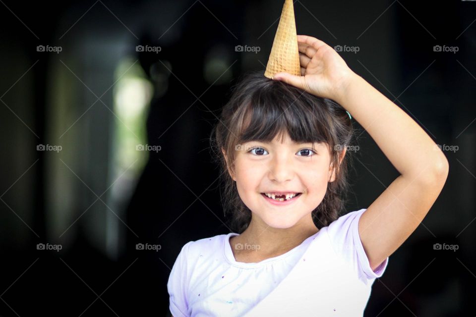 Happy girl with an ice cream cone