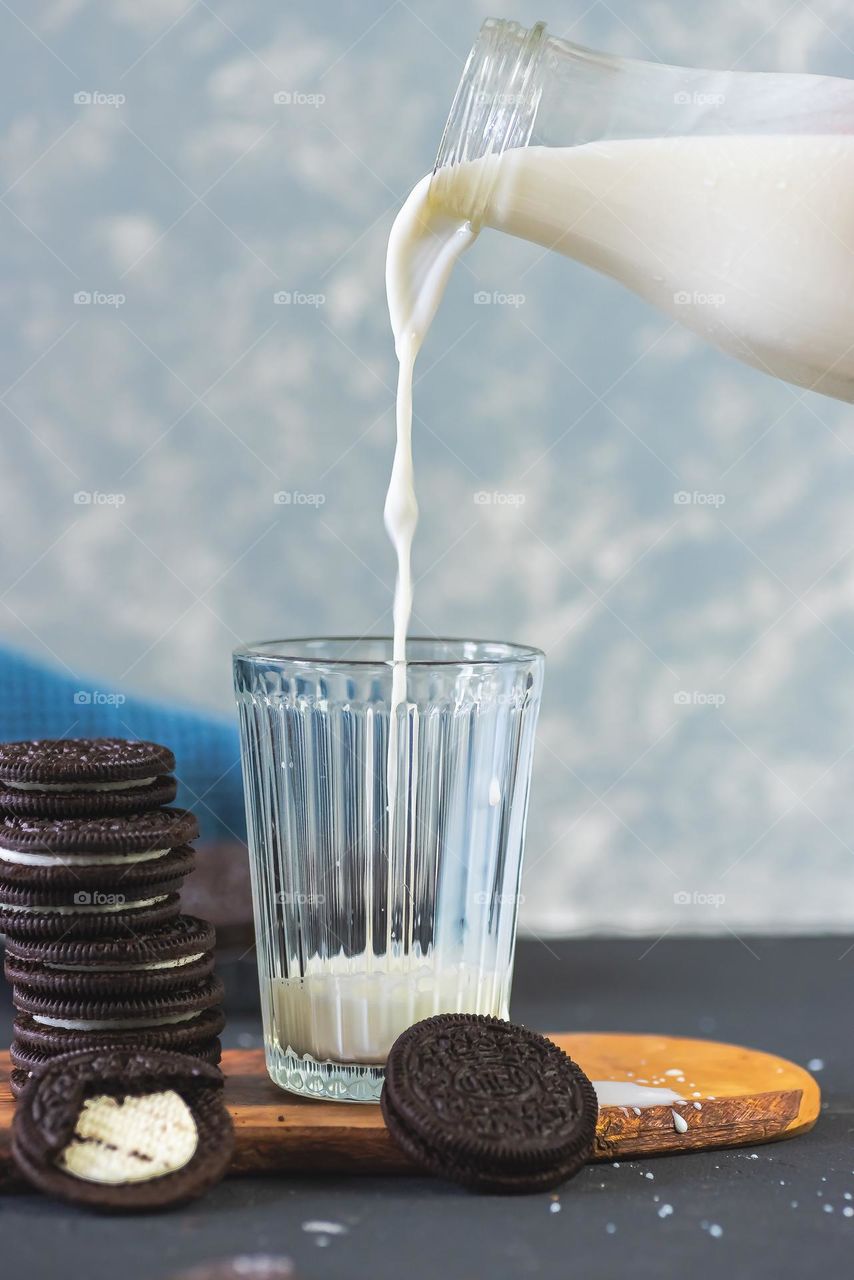 Milk pouring in glass.