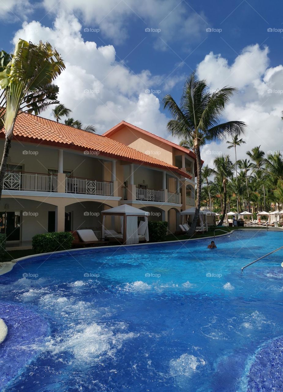 Travel is my life. Holiday in Dominican Republic. Majestic Elegance Hotel. Swimming pool and whirlpool. Sunny day.