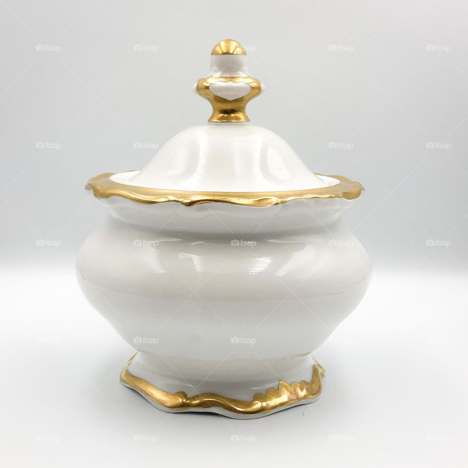 Old porcelain sugar bowl with gilded edge