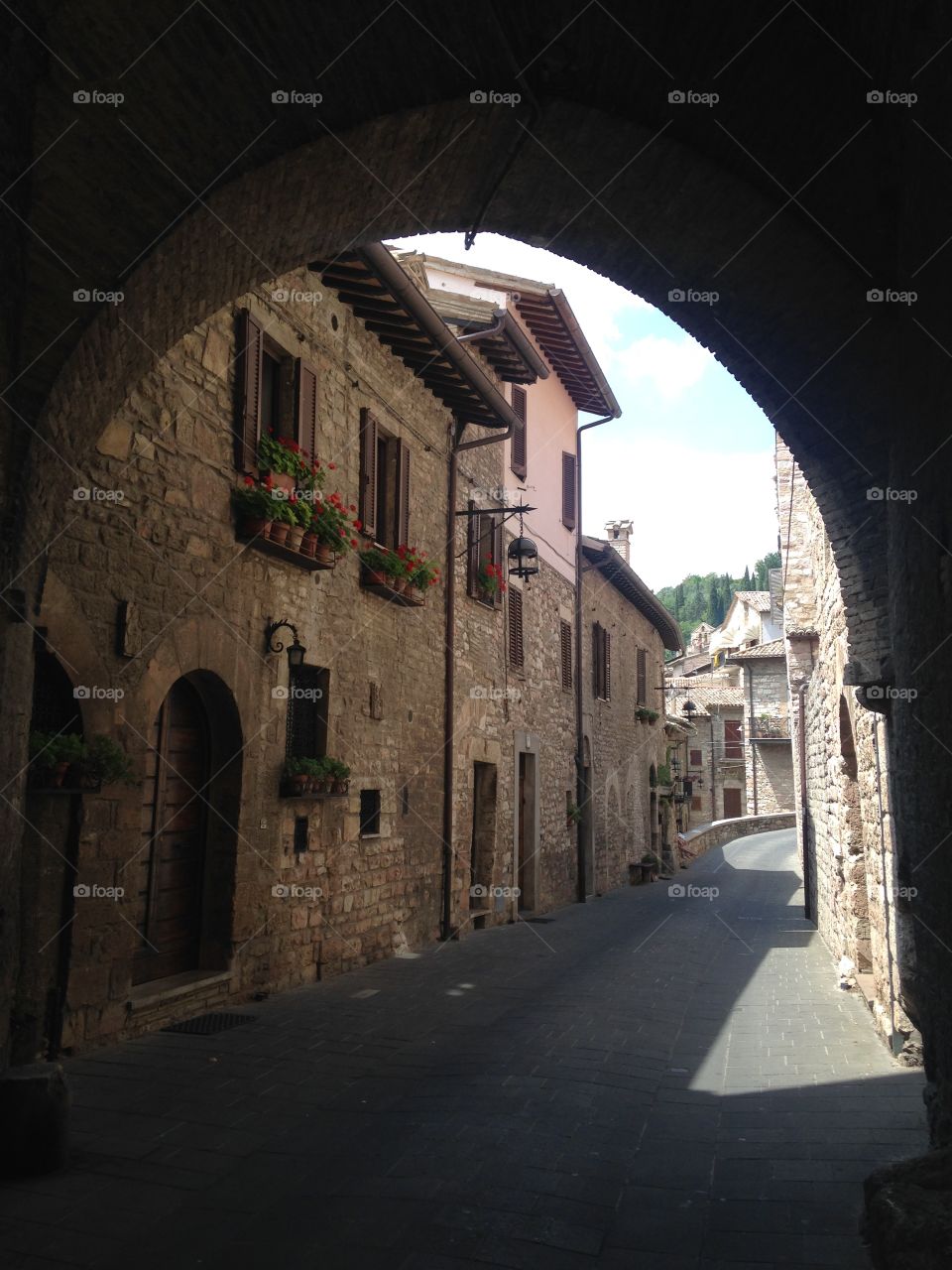 Looking through . Assisi town behind the arch
