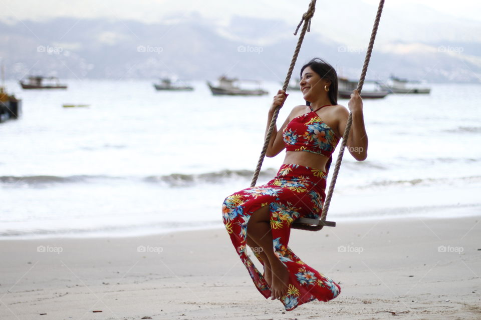 a happy woman on a swing