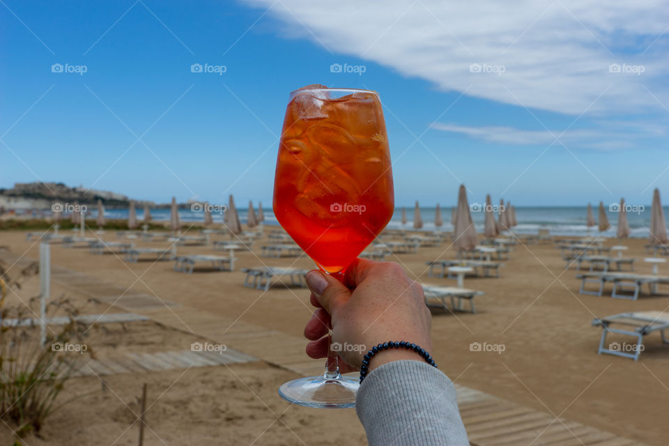 orange drink on the beach