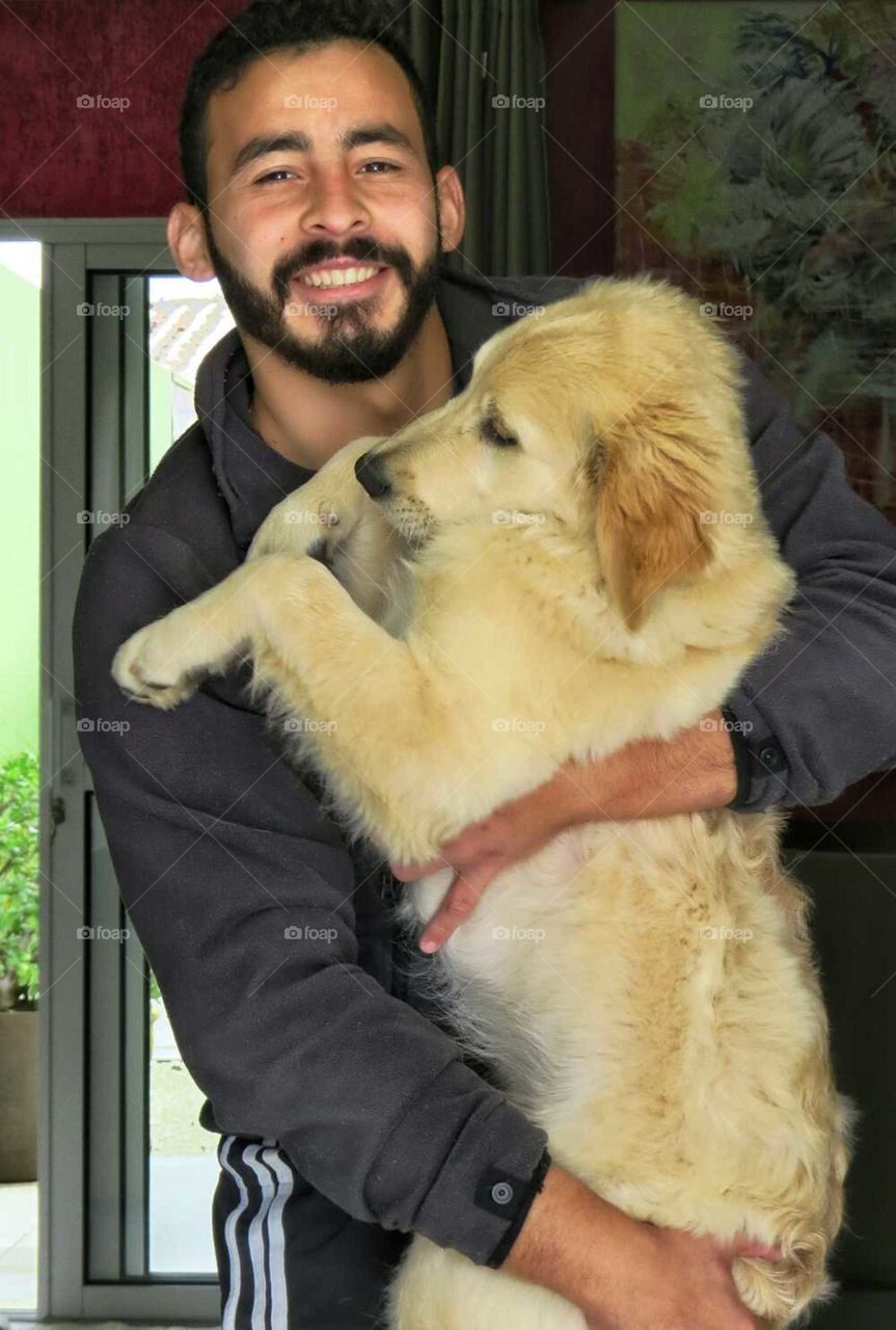 Man holding a dog