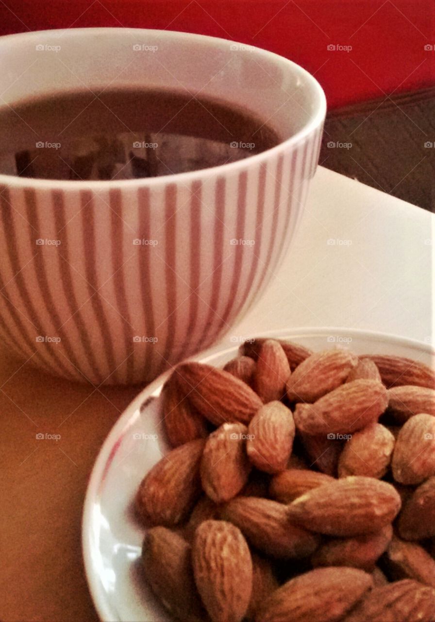 Cup of tea and almonds