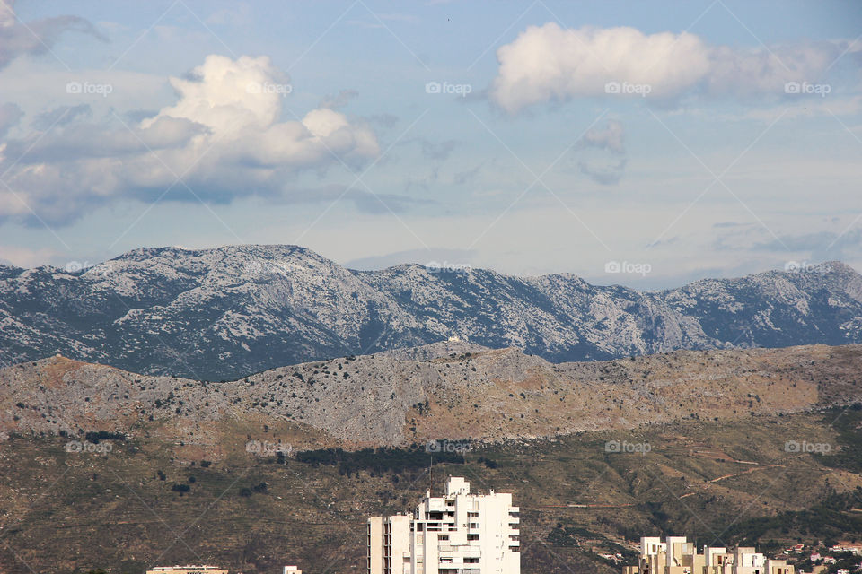 Mountains behind a city