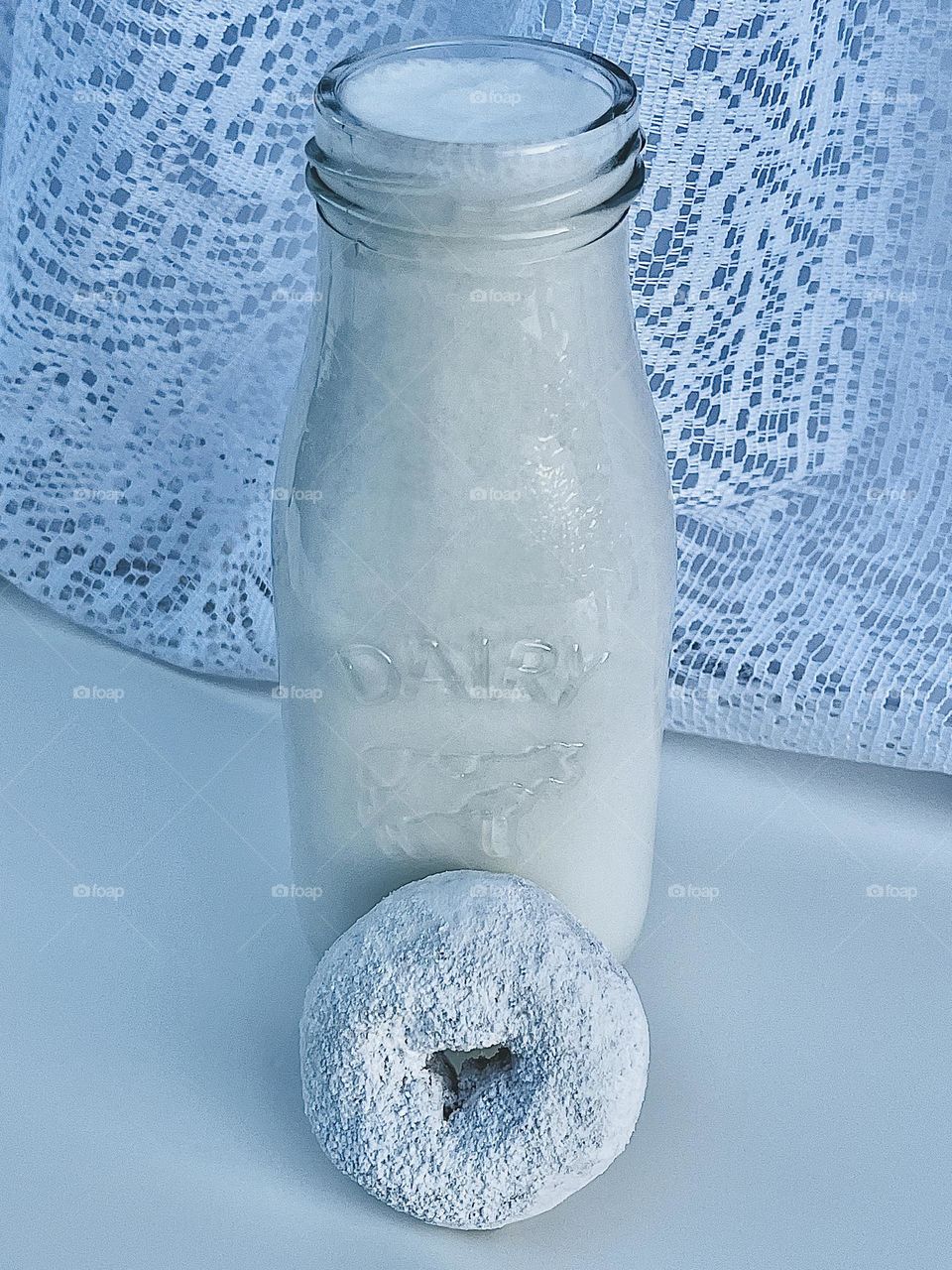 One White Powdered Donut and Milk