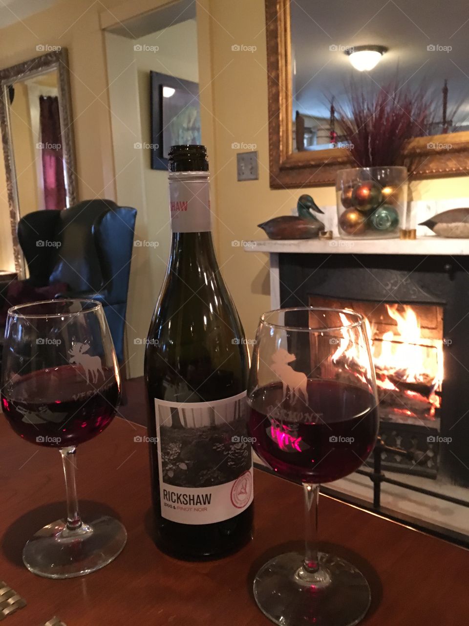 A cozy dinner and wine next to the fireplace in Vermont