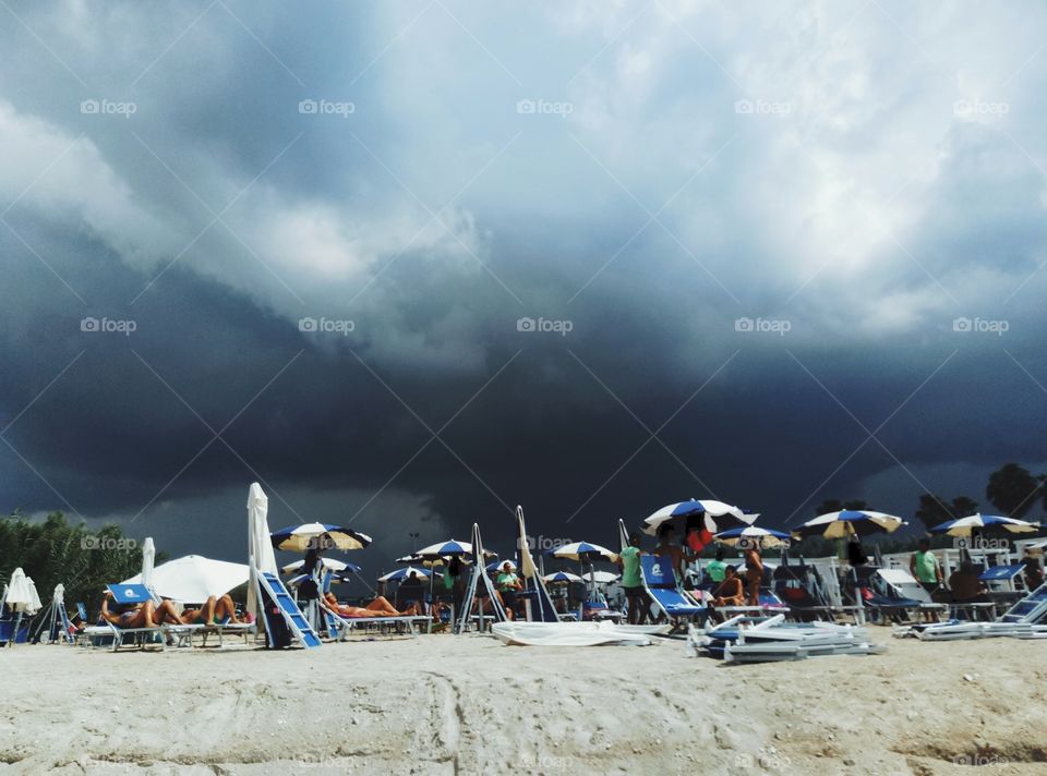 Not the best day to go to swim. A heavy storm is approaching the beach in Puglia, Italy