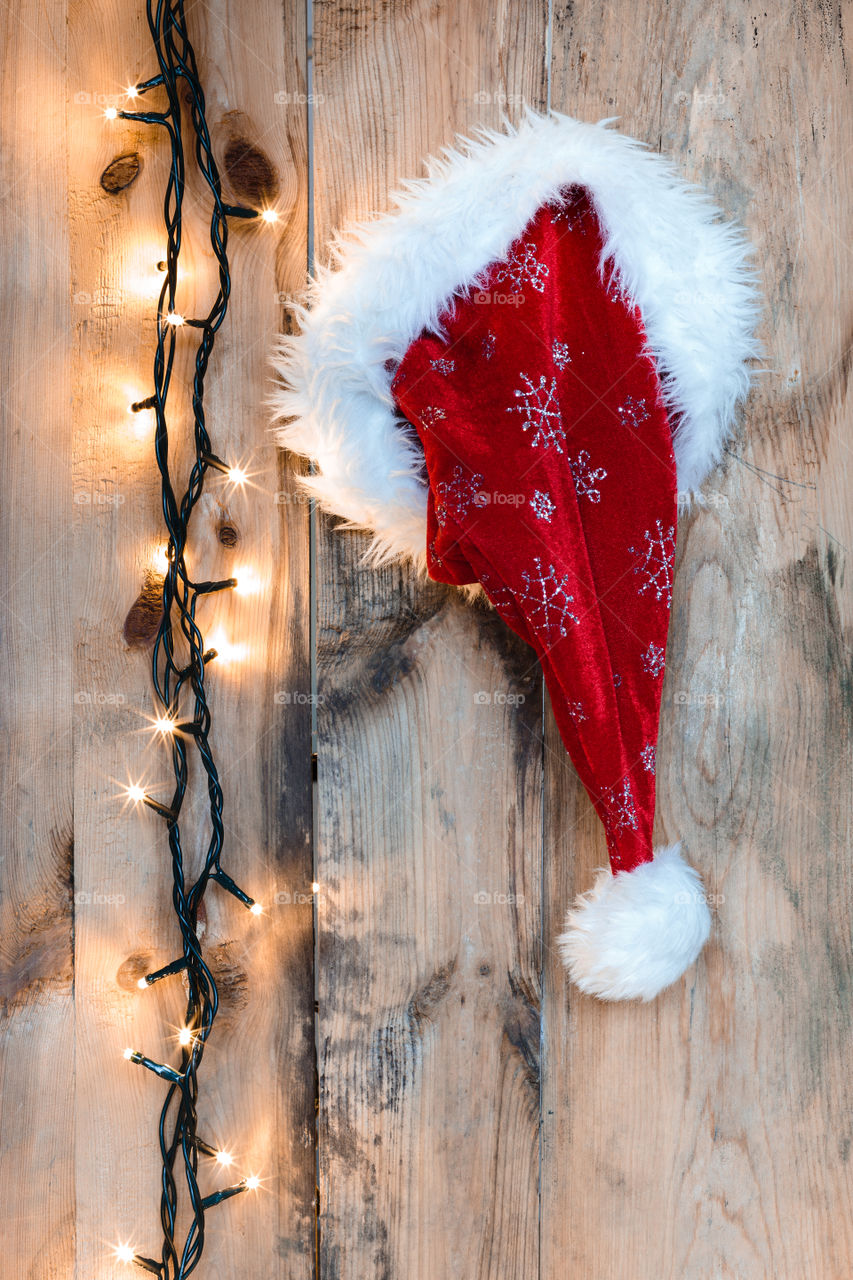 Santa Claus hat hung on wall. Santa Claus hat hung on a wooden wall