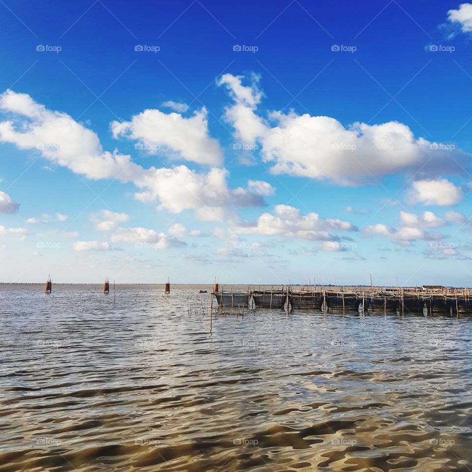 Scenic view of lake against blue sky