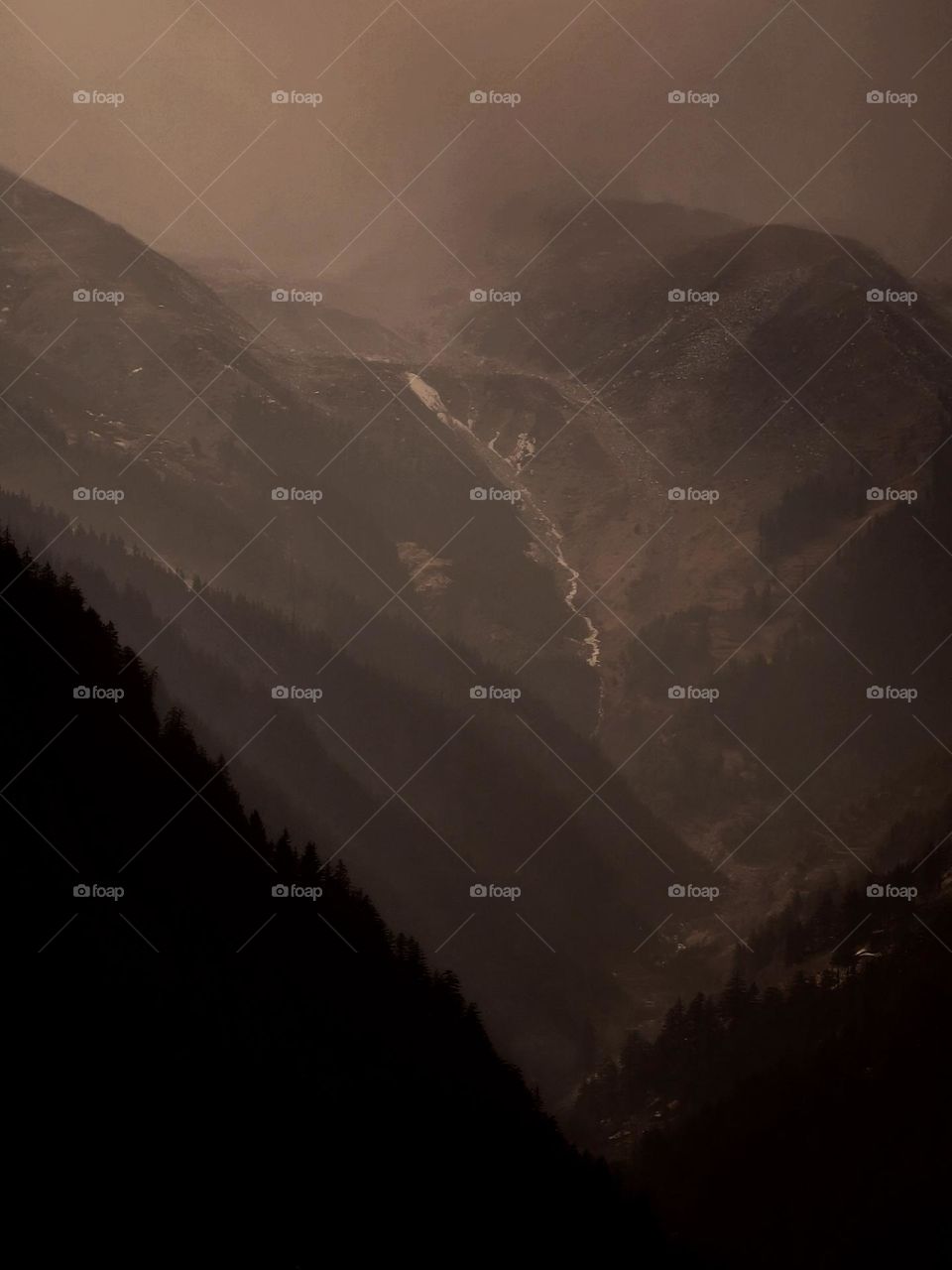 a cloudy snowing day on peaks