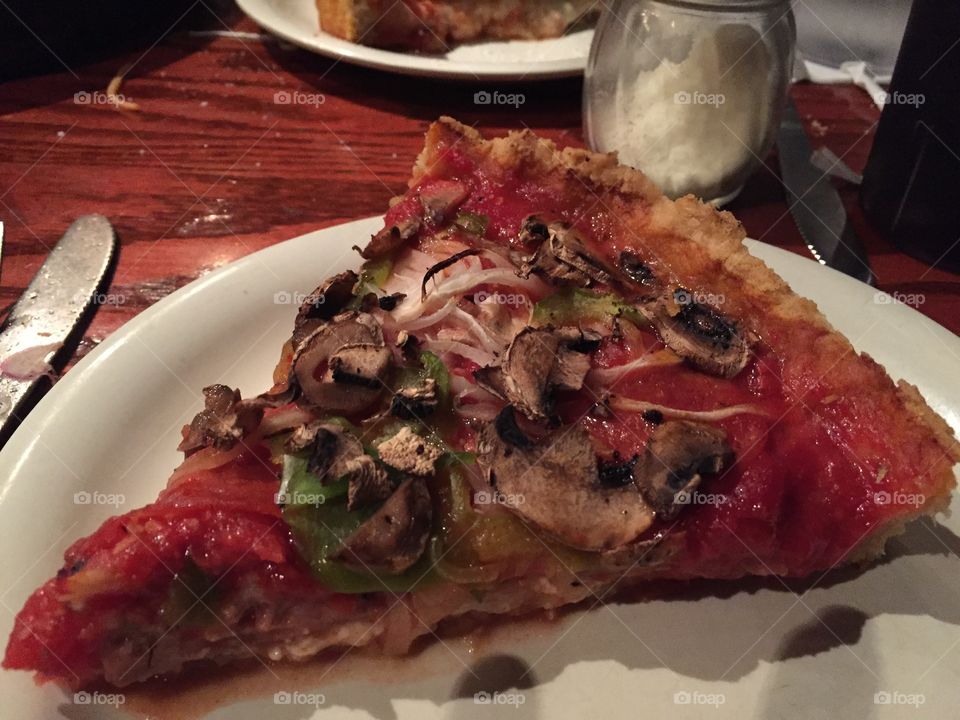 A slice of Chicago deep dish pizza