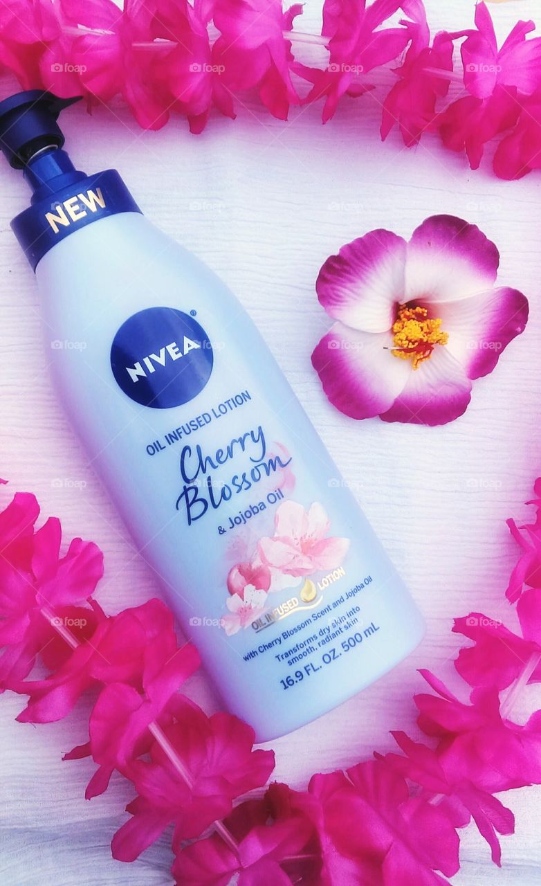 NIVEA lotion pink lei and hibiscus flower