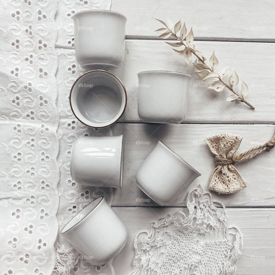 Vintage china glasses on a old lace