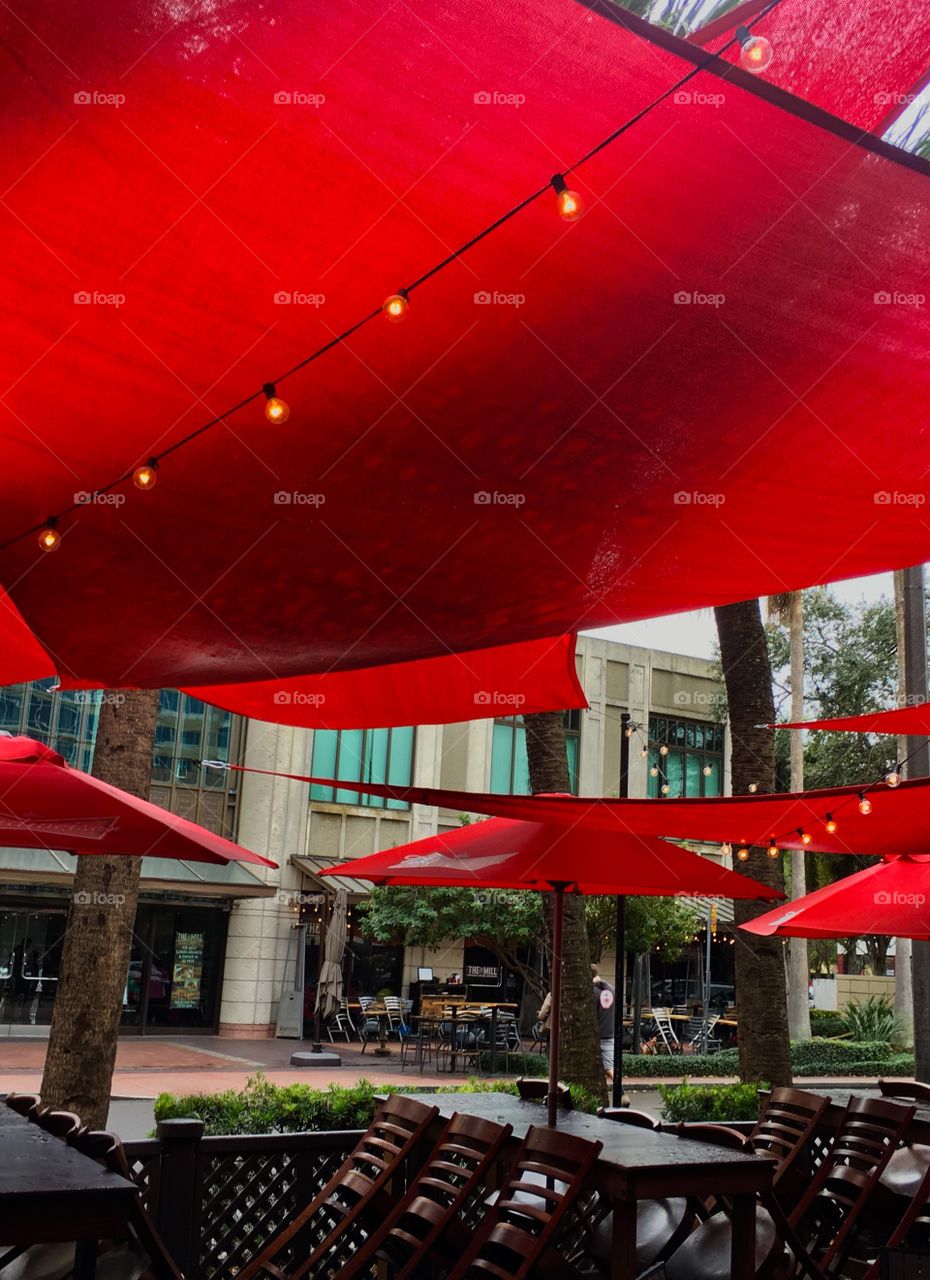 Red sails over sidewalk cafe
