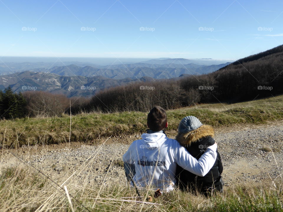 A loving couple looking the view