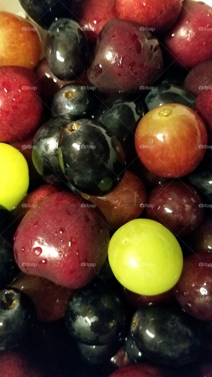 grapes, grapes and more grapes,  black. green, red and cherries on top. yummy
