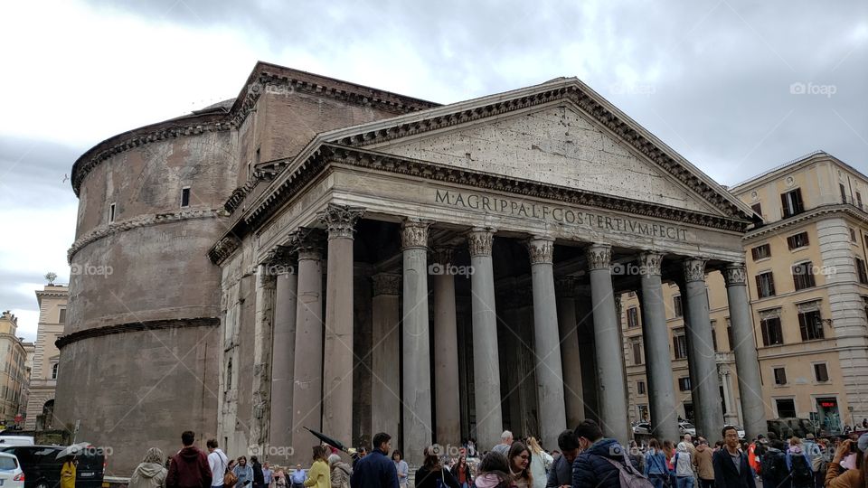 The famous Pantheon in Rome, Italy, Europe, busy with tourists on cloudy spring day.