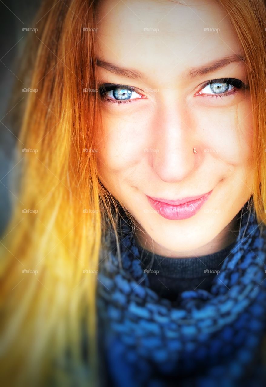 girl with red hair and sky-colored eyes