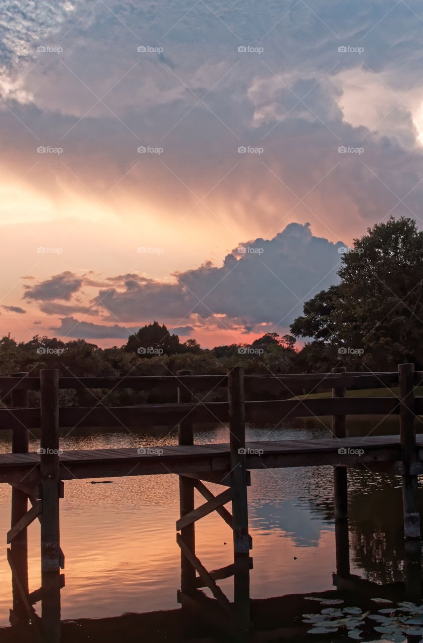 Clouds Reflected in Lake. The colorful clouds lit by the setting sun are reflected in a lake. 