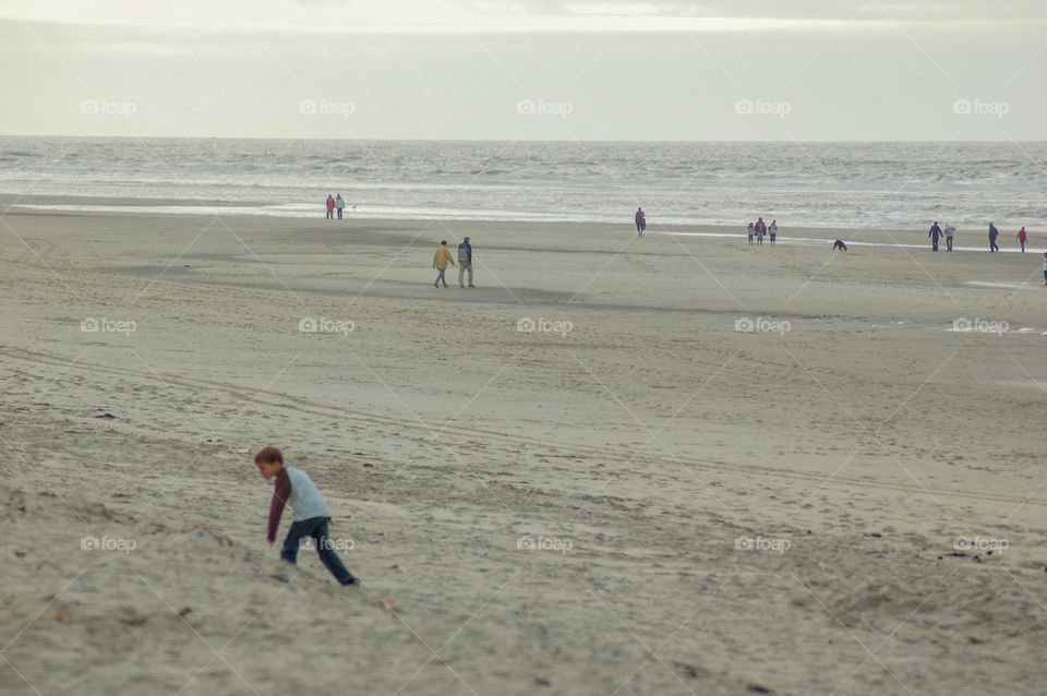 Boy Playing In The Sand