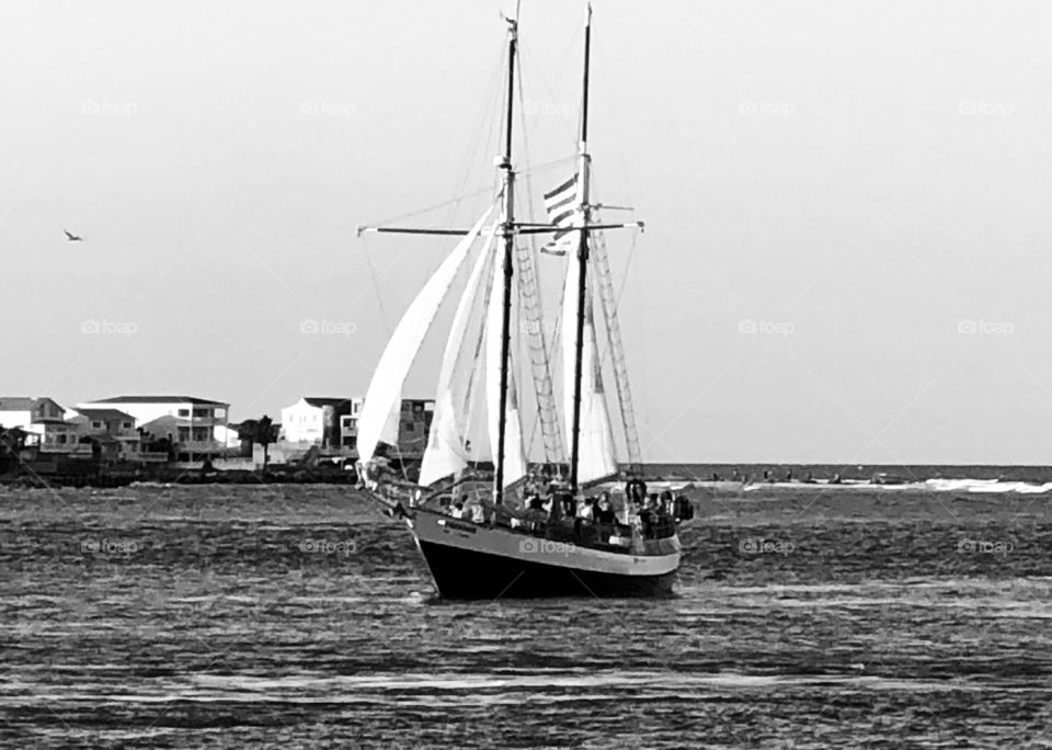 A monochromatic boat on the open water. Truly a beautiful sight to see