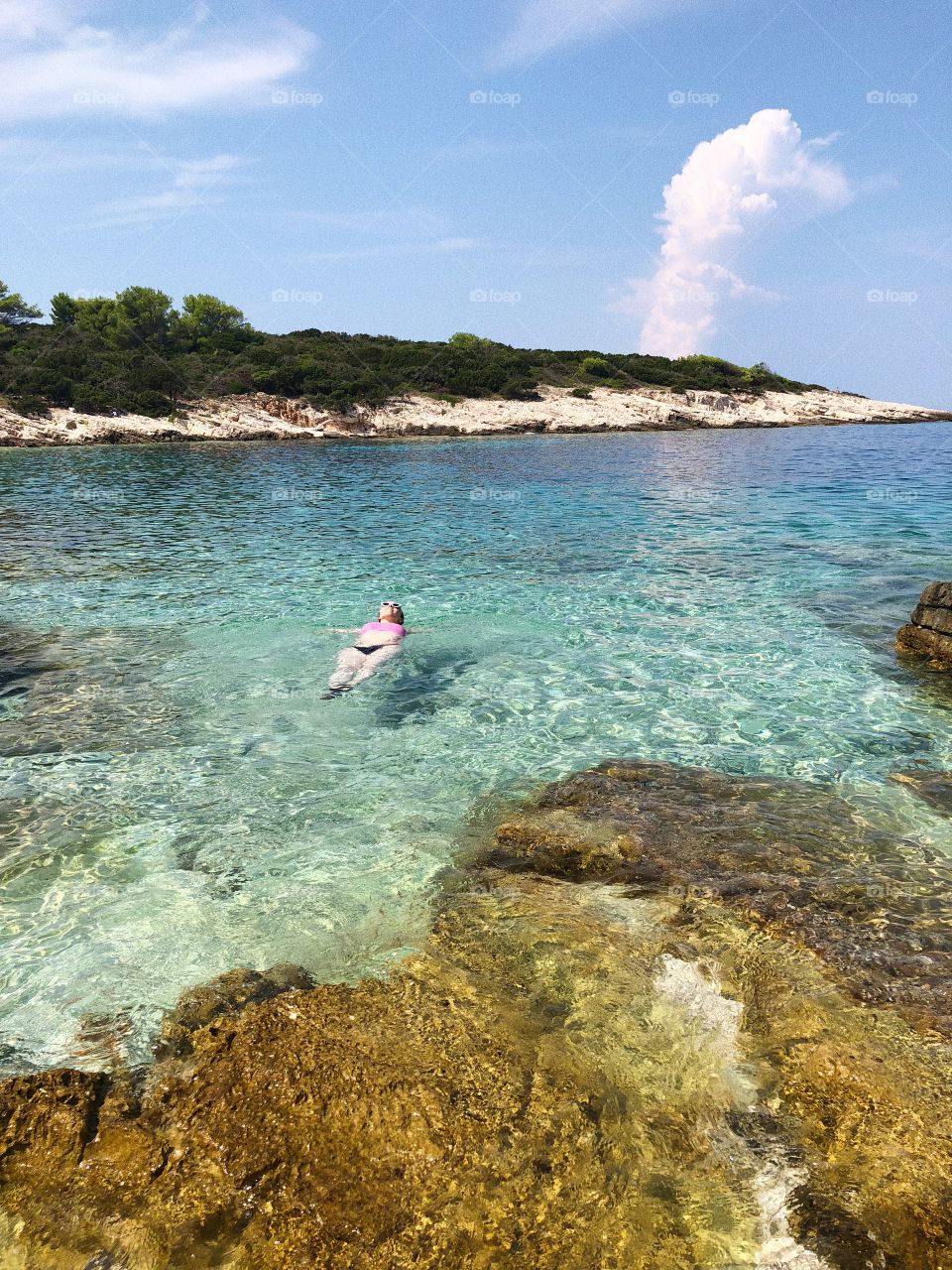 Woman floating in Adriatic Sea