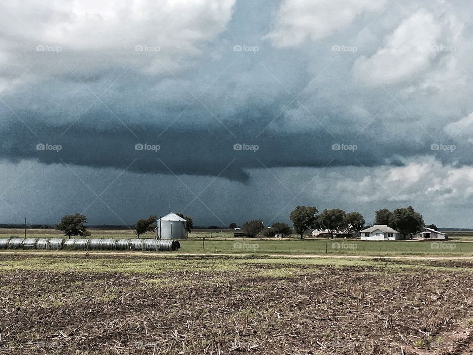 Storm clouds over rural landscape
