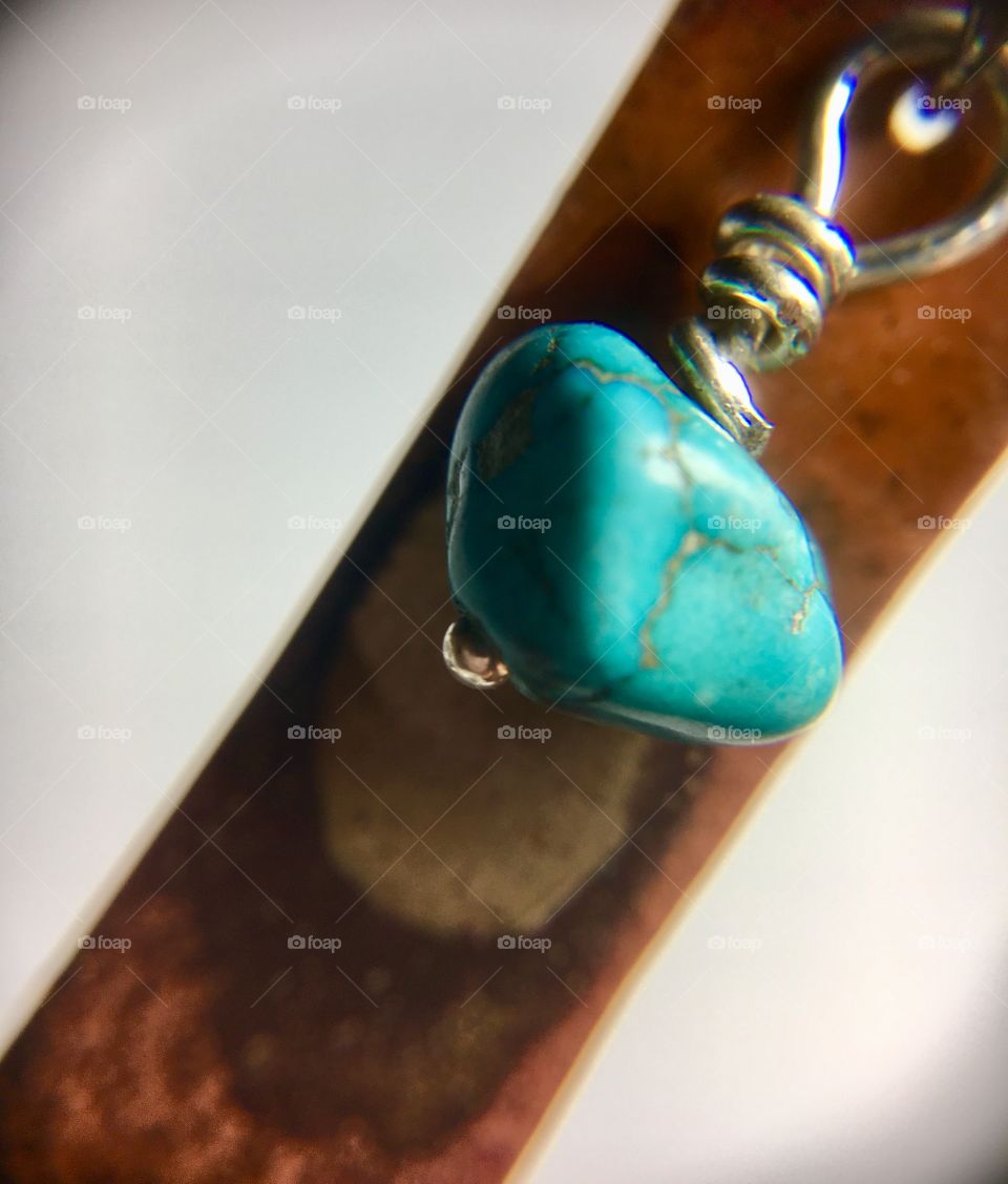 Turquoise nugget on copper and silver 