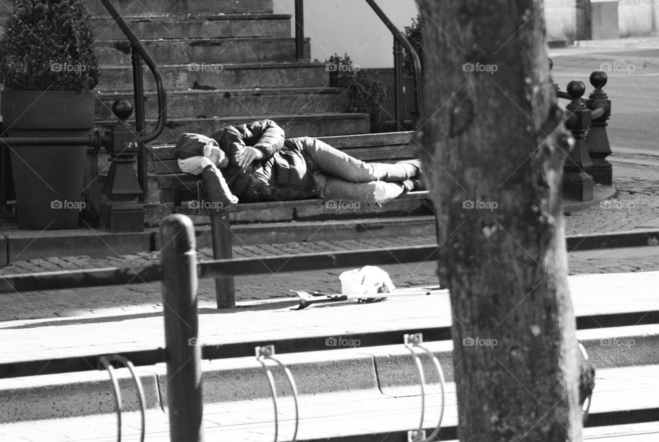 Man sleeping on bench