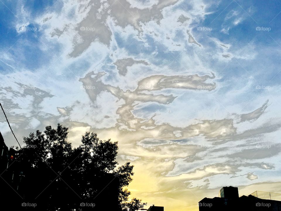 Clouds in the sky appearing like metallic quicksilver or the “waters above close to the firmament of heaven”. Picture was taken in Long Island City, Queens, New York in the Spring of 2019. Hypnotic Productions