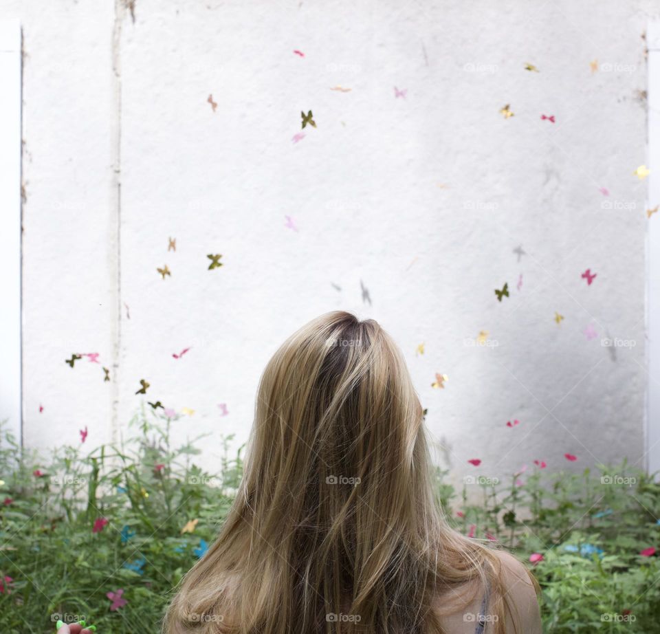 Surrounded By Pink Paper Butterflies