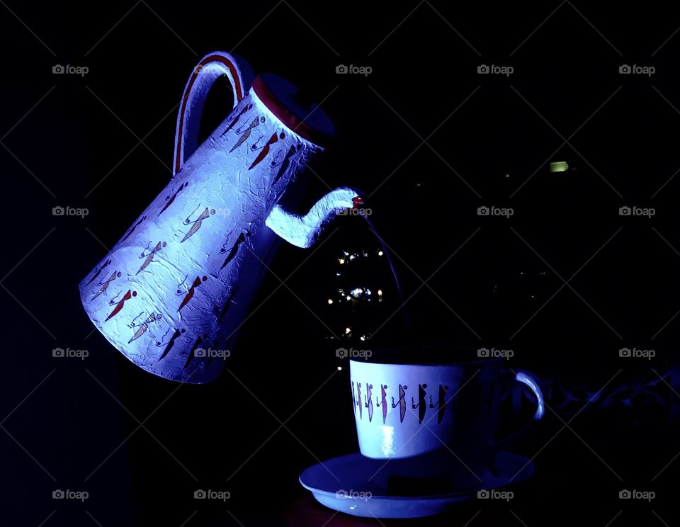 Teapot serving a cup of tea 
