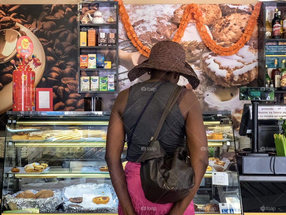 A customer peruses the treats on offer at a cafe in Portugal 