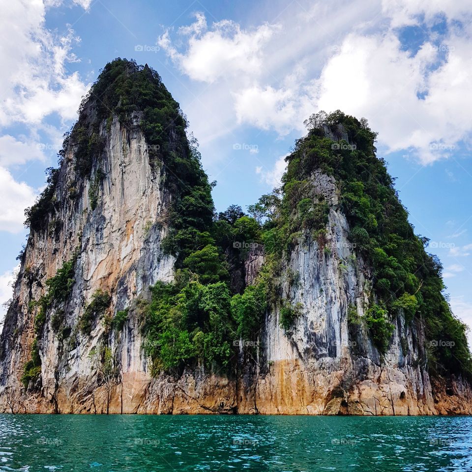 Scenic view of mountain at lake against sky