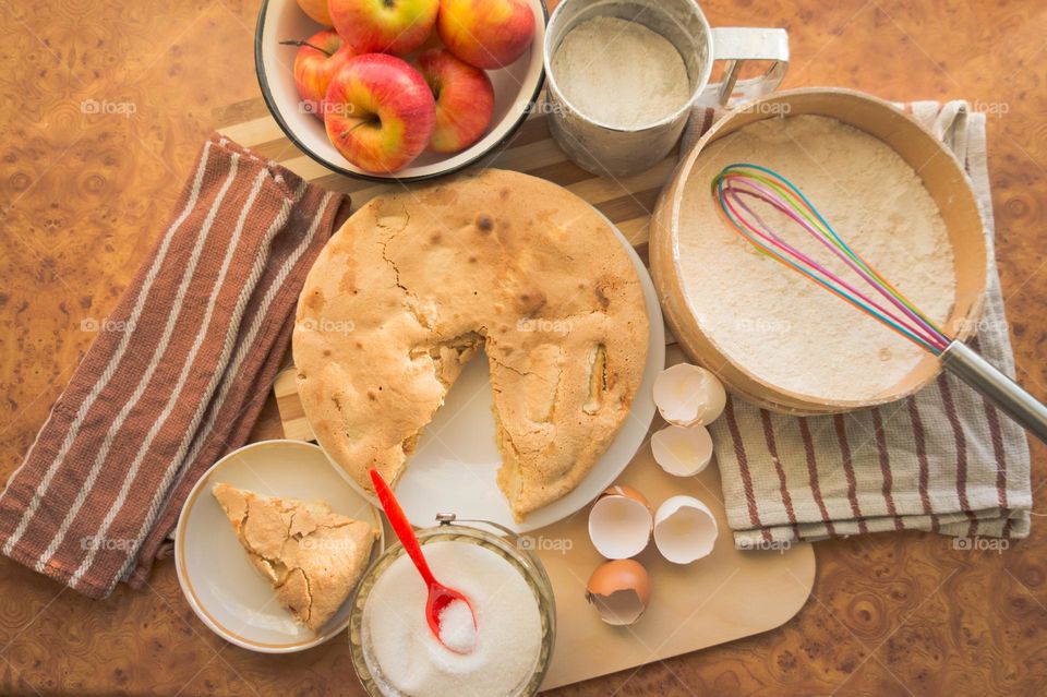 Making homemade puffed apple pie with eggs, sugar and flour.