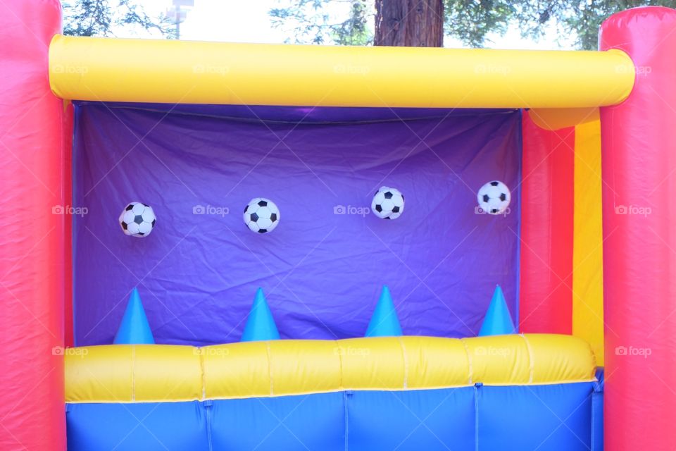 Soccer balls in an inflatable fair stall