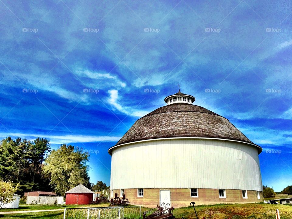 White round barn on a farm. 