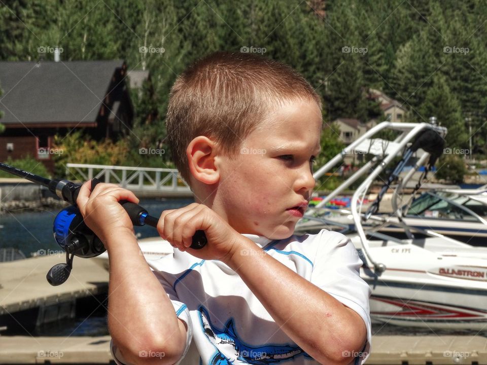 Boy Casting A Fishing Line
