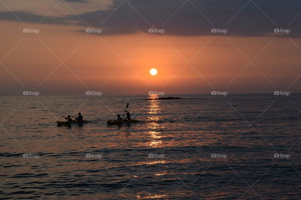 Summer beach sunset canoeing. Summer beach sunset canoeing
