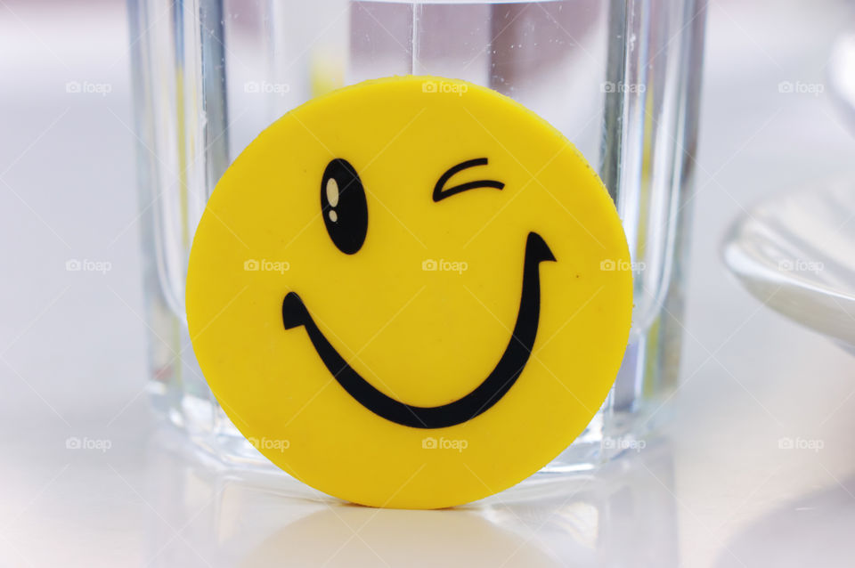 The eraser in the shape of happy emoticon