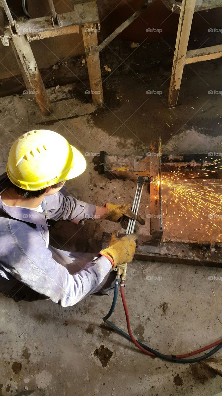 cutting steel. man working cutting steel at mining industry 