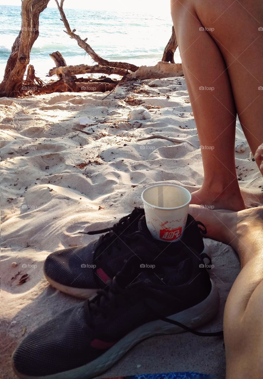 Creative cup holder out of necessity at the beach